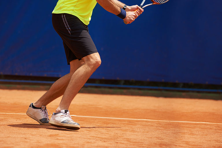 Male Tennis Player on clay court